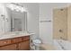 Well-maintained bathroom featuring a tiled shower-tub combination, wood vanity, and neutral color scheme at 1345 Hilltop Overlook Dr, Marietta, GA 30062