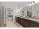 Bathroom boasts double sinks, tiled floors, granite countertops, and a separate shower at 1345 Hilltop Overlook Dr, Marietta, GA 30062