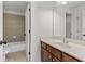 Bathroom with a vanity, granite countertop, and neutral tile floors offers a clean and functional space at 1345 Hilltop Overlook Dr, Marietta, GA 30062