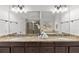 Bathroom with double sinks, granite countertops, and a large mirror at 1345 Hilltop Overlook Dr, Marietta, GA 30062
