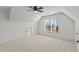 Bright bedroom with a ceiling fan, a large window, and neutral carpeting provides a calming atmosphere at 1345 Hilltop Overlook Dr, Marietta, GA 30062