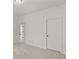 Bedroom with carpet flooring and neutral walls leading to en-suite bathroom at 1345 Hilltop Overlook Dr, Marietta, GA 30062