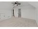Bright bedroom featuring a neutral carpet, with doorways offering seamless transition to other areas of the home at 1345 Hilltop Overlook Dr, Marietta, GA 30062