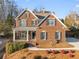 Charming two-story brick home with well-maintained landscaping, a welcoming front porch and attached two-car garage at 1345 Hilltop Overlook Dr, Marietta, GA 30062