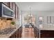 Stylish kitchen with granite countertops, stainless steel appliances, and a breakfast bar, perfect for casual dining at 1345 Hilltop Overlook Dr, Marietta, GA 30062