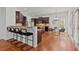 Modern kitchen featuring dark wood cabinetry, granite countertops, stainless steel appliances, and breakfast bar seating at 1345 Hilltop Overlook Dr, Marietta, GA 30062
