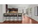 Kitchen with granite countertops, breakfast bar, stainless appliances and dark wood cabinets at 1345 Hilltop Overlook Dr, Marietta, GA 30062