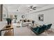 The living room features neutral carpeting, modern trim detail, and plentiful furniture for seating at 1345 Hilltop Overlook Dr, Marietta, GA 30062