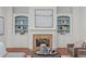 Cozy living room with fireplace, built-in shelves, and stylish decor, perfect for relaxation and entertaining at 1345 Hilltop Overlook Dr, Marietta, GA 30062