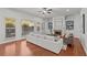 Bright living room featuring hardwood floors, built-in shelving, a fireplace, and natural light from windows at 1345 Hilltop Overlook Dr, Marietta, GA 30062