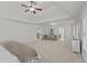 Spacious primary bedroom featuring neutral decor, large windows, sitting area and tray ceiling at 1345 Hilltop Overlook Dr, Marietta, GA 30062