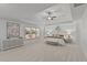 Spacious primary bedroom featuring tray ceiling, neutral decor, and large windows at 1345 Hilltop Overlook Dr, Marietta, GA 30062