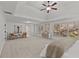 Spacious primary bedroom with a ceiling fan, sitting area, and lots of natural light at 1345 Hilltop Overlook Dr, Marietta, GA 30062