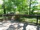 Wooden deck overlooking backyard with mature trees at 732 Vinson Sw Pl, Atlanta, GA 30315