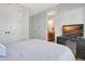 Bright bedroom with a tv and doorway view into the bathroom, a comfortable and convenient layout at 209 Wynnward Way, Sharpsburg, GA 30277