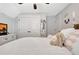 Bedroom with shiplap detail, plush white rug, and TV at 209 Wynnward Way, Sharpsburg, GA 30277