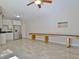 Finished basement bonus room featuring a kitchenette, tile flooring, and ample space for recreation at 209 Wynnward Way, Sharpsburg, GA 30277