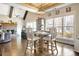 Open dining space with vaulted ceiling, stone fireplace, and views into the living room at 209 Wynnward Way, Sharpsburg, GA 30277