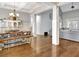 Bright, open dining room with modern chandelier and hardwood floors at 209 Wynnward Way, Sharpsburg, GA 30277