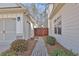Exterior walkway between the garage and the house, leading to a fenced backyard at 209 Wynnward Way, Sharpsburg, GA 30277