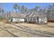 Beautiful single-story home with a well-manicured front yard and stone accents at 209 Wynnward Way, Sharpsburg, GA 30277