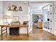 Inviting foyer with rustic decor, opening up to a bright and airy office space through glass doors at 209 Wynnward Way, Sharpsburg, GA 30277