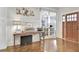 Stylish foyer features a rustic table display, adding charm and character to the home's entrance at 209 Wynnward Way, Sharpsburg, GA 30277