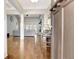 Open-concept foyer leading to living areas with hardwood floors at 209 Wynnward Way, Sharpsburg, GA 30277