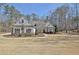 Charming single-story home with a well-manicured front yard at 209 Wynnward Way, Sharpsburg, GA 30277