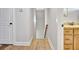 Hallway area featuring hardwood flooring and access to bathroom at 209 Wynnward Way, Sharpsburg, GA 30277