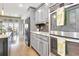 Beautiful kitchen stainless appliances, granite countertops and wooden floors at 209 Wynnward Way, Sharpsburg, GA 30277