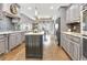 Updated kitchen with stainless appliances, granite countertops and large island at 209 Wynnward Way, Sharpsburg, GA 30277