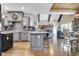 Modern kitchen with center island, granite countertops, and stainless steel appliances at 209 Wynnward Way, Sharpsburg, GA 30277