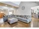 Open-concept living area with wooden ceiling, large comfy couch and lots of room at 209 Wynnward Way, Sharpsburg, GA 30277