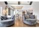 Living area featuring vaulted ceiling, hardwood floors, an open floor plan, and plenty of natural light at 209 Wynnward Way, Sharpsburg, GA 30277