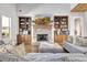 Inviting living room with stone fireplace, custom built-ins, and comfortable seating at 209 Wynnward Way, Sharpsburg, GA 30277