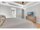 View of the bedroom with hardwood floors, TV and comfortable furniture at 209 Wynnward Way, Sharpsburg, GA 30277