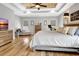 Main bedroom with wood floors, ceiling fan, and cozy decor at 209 Wynnward Way, Sharpsburg, GA 30277