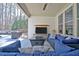 Comfortable outdoor living area featuring plush seating, a ceiling fan, and a view of the backyard pool at 209 Wynnward Way, Sharpsburg, GA 30277