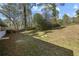 The backyard features a gentle slope and plenty of room for Gathering fun at 3680 Larkspur Ter, Decatur, GA 30032