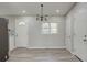 Open dining area featuring a modern light fixture, sleek floors and neutral tones at 3680 Larkspur Ter, Decatur, GA 30032