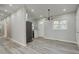 Bright dining space featuring a contemporary light fixture and views of the side yard at 3680 Larkspur Ter, Decatur, GA 30032