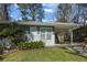 View of a well-kept home featuring a cozy front porch and a convenient carport at 3680 Larkspur Ter, Decatur, GA 30032
