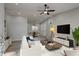 Bright, neutrally decorated living room with vaulted ceiling, ceiling fan, and sleek floors at 3680 Larkspur Ter, Decatur, GA 30032