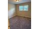 Cozy bedroom featuring neutral walls and plush carpeting for added comfort at 3990 N Quail Dr, Douglasville, GA 30135