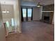 Spacious living room with a cozy fireplace and ample natural light at 3990 N Quail Dr, Douglasville, GA 30135
