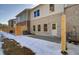 Rear view of a townhome with a fenced backyard, small patio, and well-maintained exterior at 4525 Twinberry Dr, Powder Springs, GA 30127