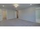 A large, empty bedroom with light grey carpet and white trim offers a clean, blank canvas at 4525 Twinberry Dr, Powder Springs, GA 30127