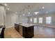 Open concept kitchen with a large island, stainless steel appliances, and ample natural light at 4525 Twinberry Dr, Powder Springs, GA 30127