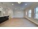Spacious living area featuring wood floors and natural lighting at 4525 Twinberry Dr, Powder Springs, GA 30127